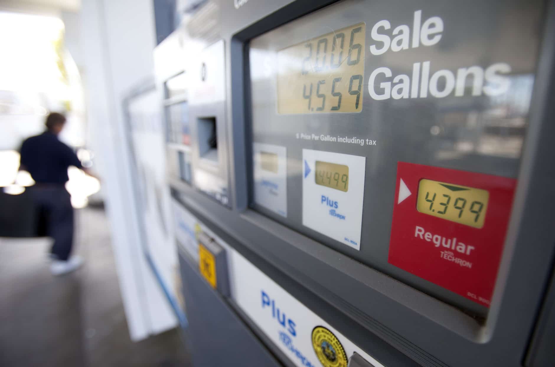 In this Feb. 21, 2012 photo, a man passes a gas pump showing the price of regular gasoline at a gas station, in San Diego. A sharp jump in gas prices drove a measure of US consumer costs up in February. But outside higher pump prices, inflation stayed mild. (AP Photo/Gregory Bull)
