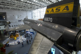 Visitors tour the Smithsonian National Air and Space Museum in Washington, Tuesday, Jan. 1, 2019, as a partial government shutdown stretches into its third week. Smithsonian museums are expected to to close Jan. 2. A high-stakes move to reopen the government will be the first big battle between Nancy Pelosi and President Donald Trump as Democrats come into control of the House.  (AP Photo/Jose Luis Magana)