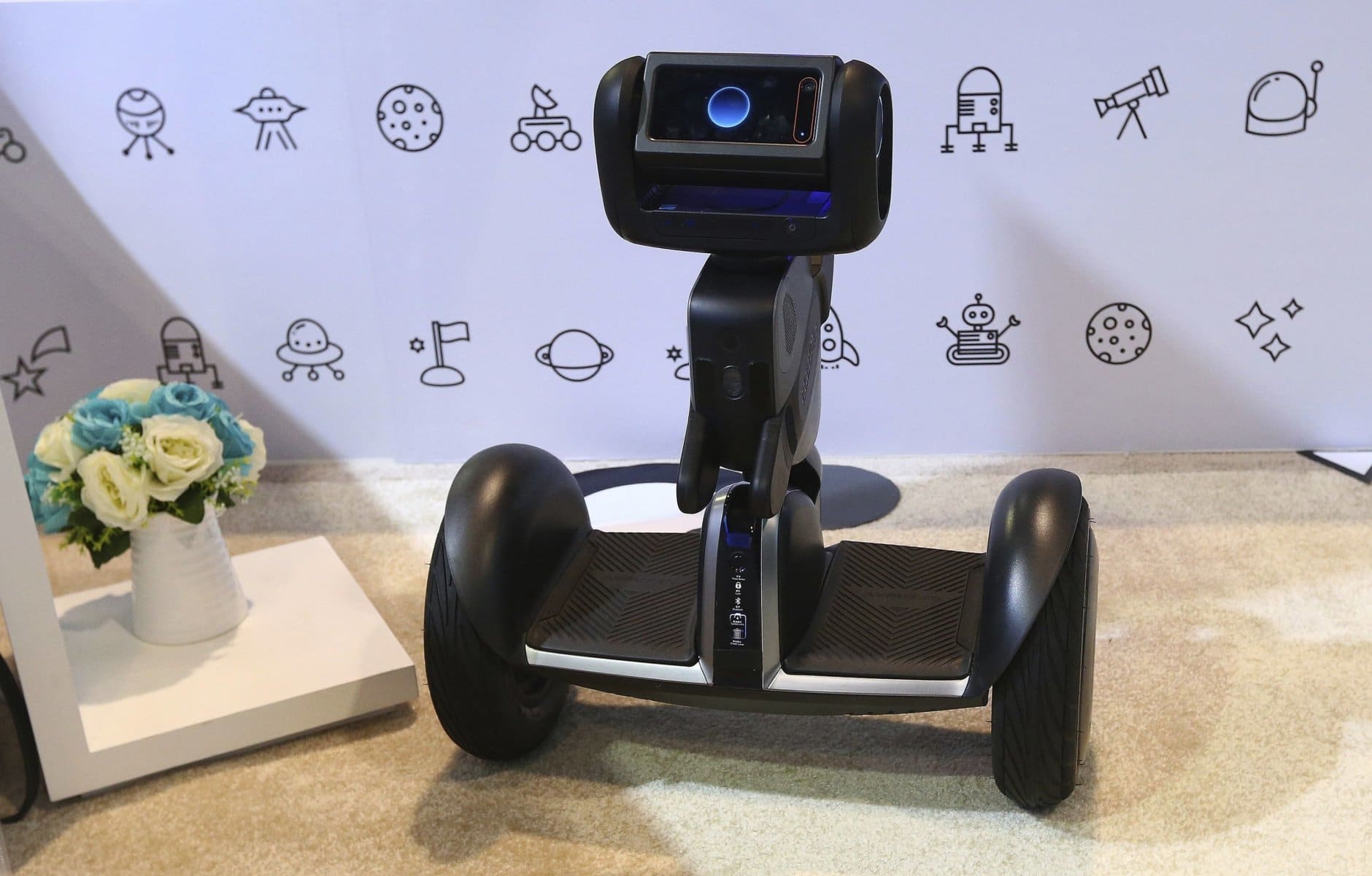 Segway shows off the new Segway-Ninebot Loomo Delivery robot which is the company's initial autonomous vehicle, designed to revolutionize the short distance delivery industry for take-outs, parcels, and goods according to the company, shown at CES International Tuesday, Jan. 8, 2019, in Las Vegas. (AP Photo/Ross D. Franklin)