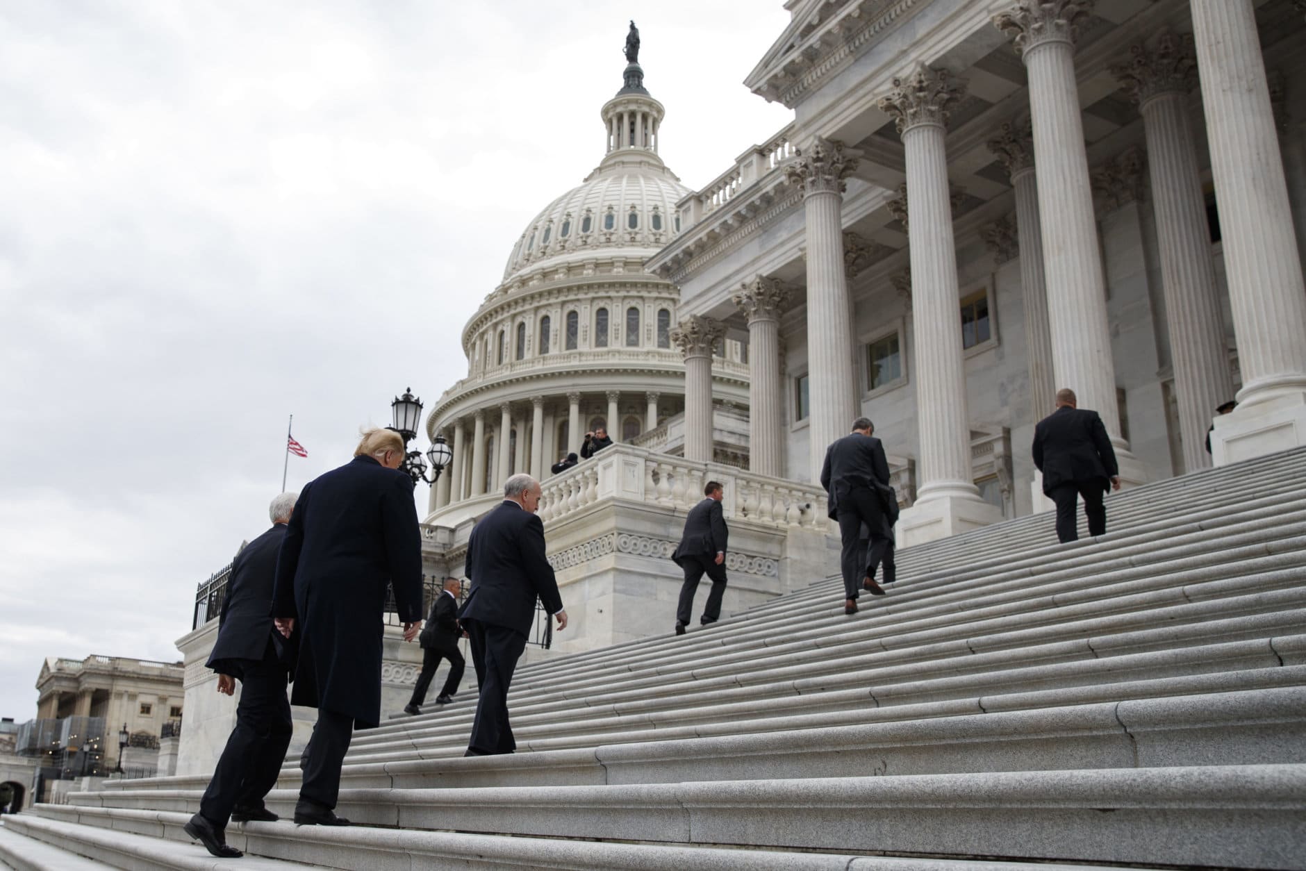 President Donald Trump and Vice President Mike Pence walk up the stairs as they arrive at the U.S. Capitol for a Senate Republican policy lunch, Wednesday, Jan. 9, 2019, in Washington. (AP Photo/ Evan Vucci)