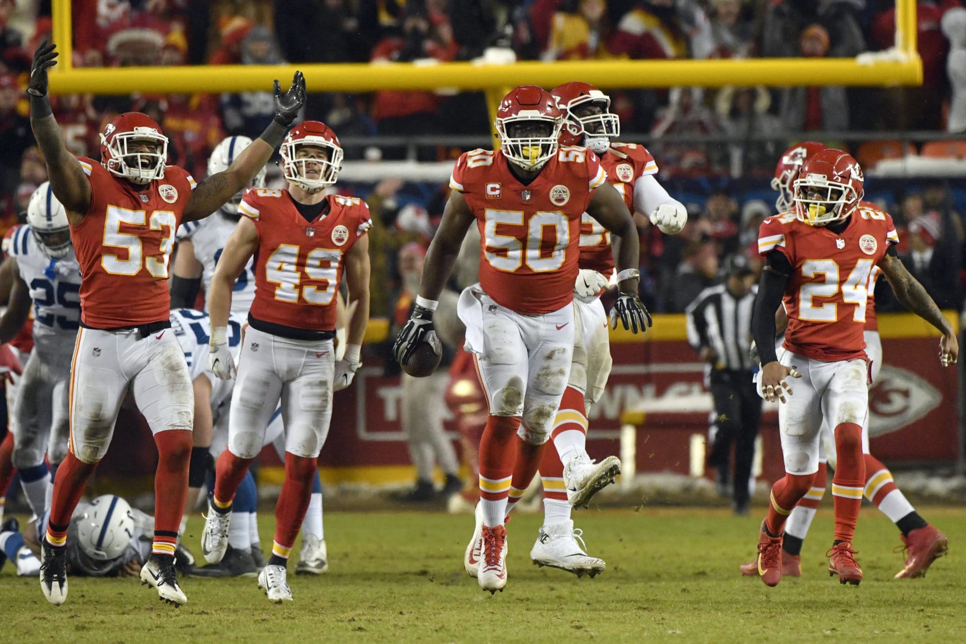 Kansas City Chiefs players celebrate after linebacker Justin Houston (50) recovered a ball fumbled by Indianapolis Colts quarterback Andrew Luck for a turnover, during the second half of an NFL divisional football playoff game in Kansas City, Mo., Saturday, Jan. 12, 2019. (AP Photo/Ed Zurga)
