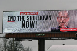 An electronic billboard, sponsored by the Democratic Coalition,  shown Saturday, Jan. 12, 2019 in Nicholasville, Ky.  McConnell, who is up for re-election in 2020 in a state where Trump tends to be more popular than he is, sees no other choice than to stand back and let the president who took the country into the shutdown decide how he wants to get out of it. (AP Photo/Timothy D. Easley)
