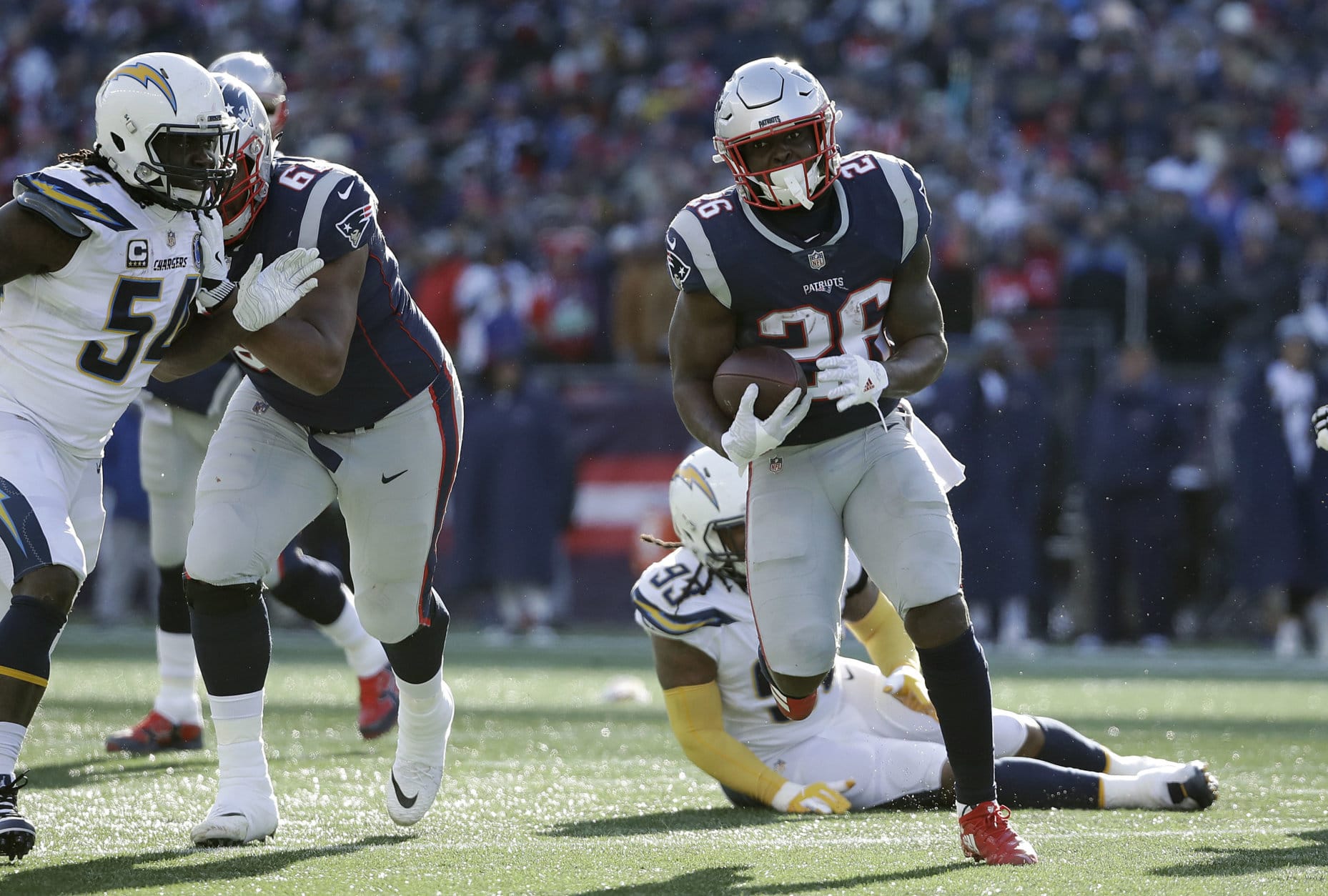 New England Patriots running back Sony Michel heads for the goal line and his second touchdown during the first half of an NFL divisional playoff football game against the Los Angeles Chargers, Sunday, Jan. 13, 2019, in Foxborough, Mass. (AP Photo/Elise Amendola)
