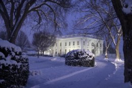 The White House is seen as snow continues to fall, Sunday, Jan. 13, 2019, in Washington. (AP Photo/Alex Brandon)