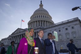 Rep. Ilhan Omar, D-Minn., left, Rep. Tom Malinowski, D-N.J., Rep. Joe Neguse, D-Colo., and other freshmen members of the House of Representatives walk to the Senate side to speak about the government shutdown on Capitol Hill, Tuesday, Jan. 15, 2019 in Washington. (AP Photo/Alex Brandon)