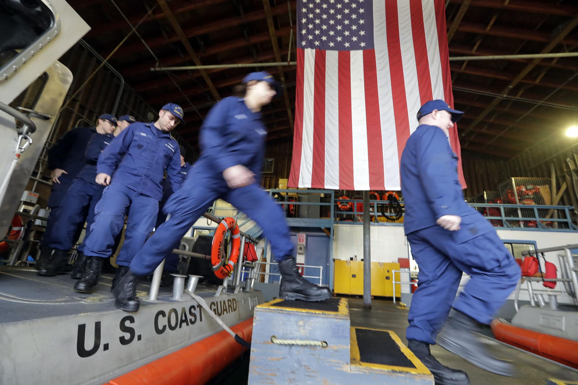 FILE In this Wednesday, Jan 16, 2019, file photo, U.S. Coast Guardsmen and women, who missed their first paycheck a day earlier during the partial government shutdown, walk off a 45-foot response boat during their shift at Sector Puget Sound base in Seattle. San Antonio-based USAA, a military personnel insurer and financial services company, said Wednesday they has donated $15 million for interest-free loans to Coast Guard members during the partial U.S. government shutdown. The funds will be disbursed by Coast Guard Mutual Assistance. The American Red Cross Hero Care Center will assist. (AP Photo/Elaine Thompson, File)