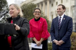 Rep. Susan Wild, D-Pa., left, accompanied by Rep. Rashida Tlaib, D-Mich., center, and Rep. Jason Crow, D-Colo., right, speaks at a news conference on Capitol Hill in Washington, Thursday, Jan. 17, 2019, to unveil the "Immediate Financial Relief for Federal Employees Act" bill which would give zero interest loans for up to $6,000 to employees impacted by the government shutdown and any future shutdowns. (AP Photo/Andrew Harnik)