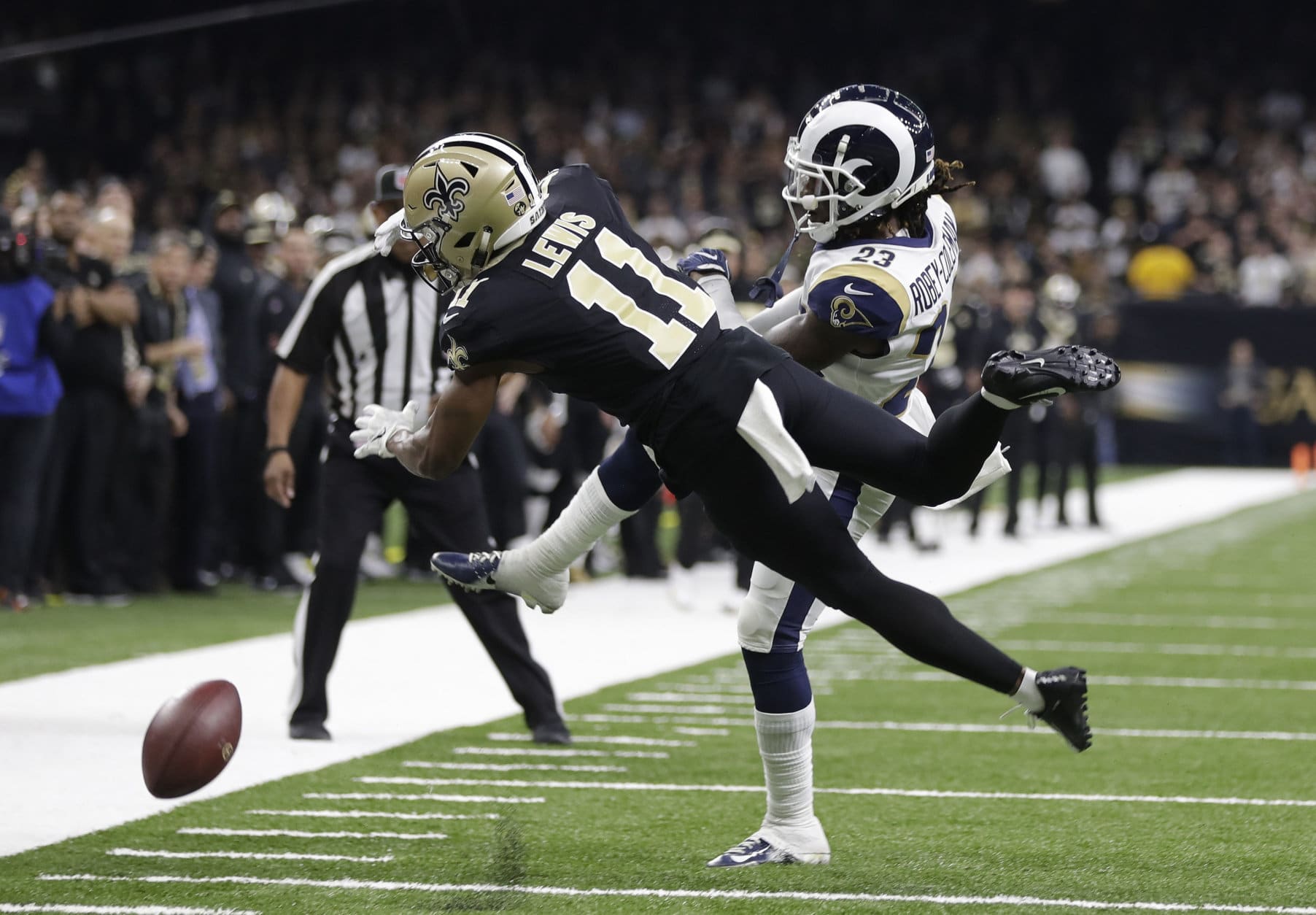 New Orleans Saints wide receiver Tommylee Lewis (11) works for a coach against Los Angeles Rams defensive back Nickell Robey-Coleman (23) during the second half the NFL football NFC championship game Sunday, Jan. 20, 2019, in New Orleans. The Rams won 26-23. (AP Photo/Gerald Herbert)
