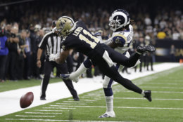 New Orleans Saints wide receiver Tommylee Lewis (11) works for a coach against Los Angeles Rams defensive back Nickell Robey-Coleman (23) during the second half the NFL football NFC championship game Sunday, Jan. 20, 2019, in New Orleans. The Rams won 26-23. (AP Photo/Gerald Herbert)