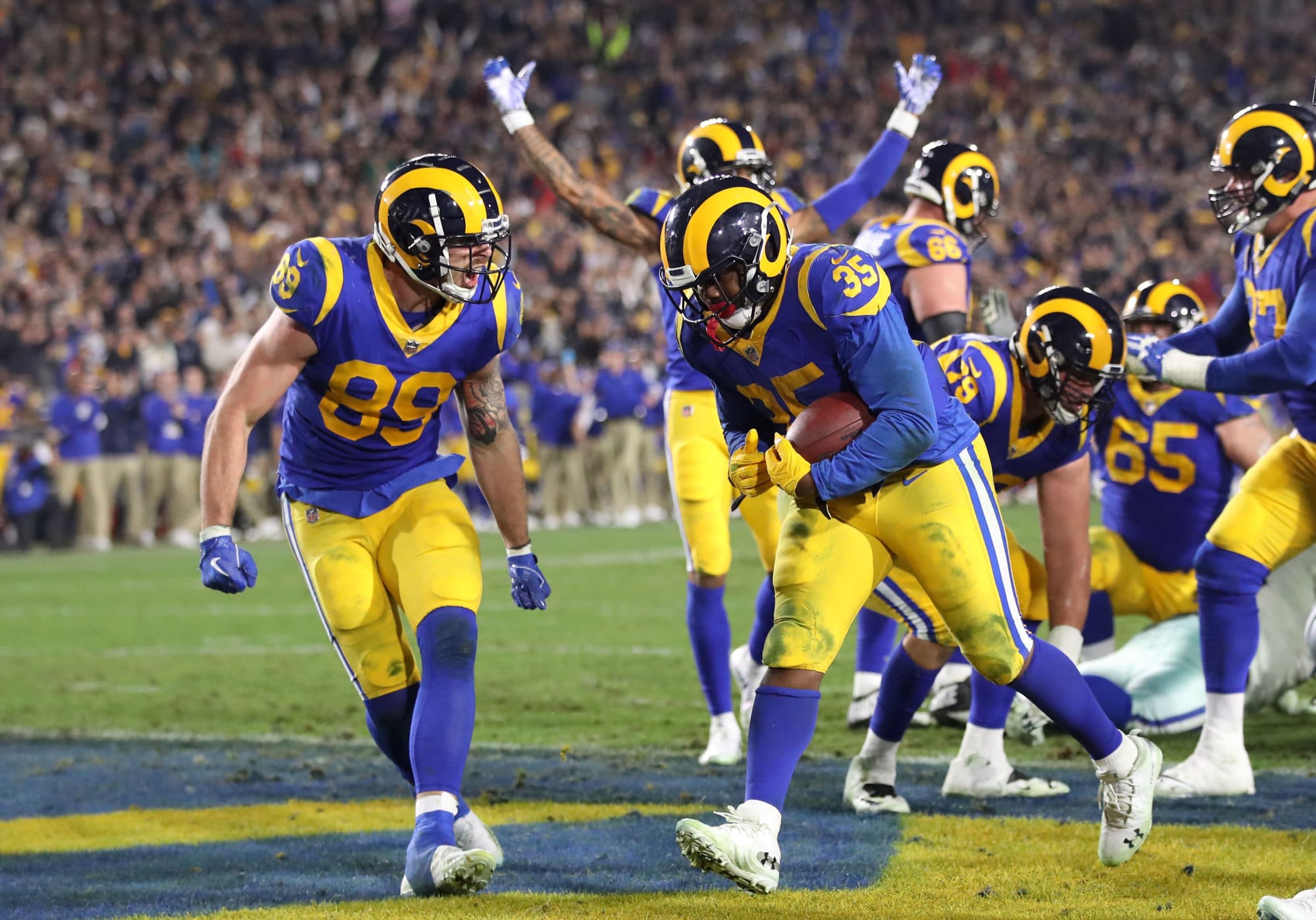 LOS ANGELES, CA - JANUARY 12:  C.J. Anderson #35 of the Los Angeles Rams celebrates with teammates after a 1 yard touchdown run in the fourth quarter against the Dallas Cowboys in the NFC Divisional Playoff game at Los Angeles Memorial Coliseum on January 12, 2019 in Los Angeles, California.  (Photo by Sean M. Haffey/Getty Images)
