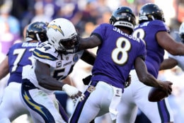 BALTIMORE, MARYLAND - JANUARY 06: Lamar Jackson #8 of the Baltimore Ravens gets sacked by Melvin Ingram #54 of the Los Angeles Chargers during the third quarter in the AFC Wild Card Playoff game at M&amp;T Bank Stadium on January 06, 2019 in Baltimore, Maryland. (Photo by Patrick Smith/Getty Images)