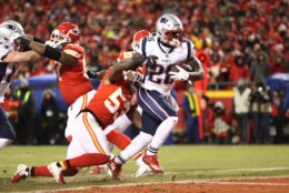 KANSAS CITY, MISSOURI - JANUARY 20:  Sony Michel #26 of the New England Patriots rushes for a 1-yard touchdown in the first quarter as Anthony Hitchens #53 of the Kansas City Chiefs attempts to tackle him during the AFC Championship Game at Arrowhead Stadium on January 20, 2019 in Kansas City, Missouri. (Photo by Jamie Squire/Getty Images)