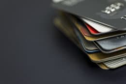 Stack of multicolored credit cards close-up