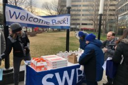 The Southwest Business Improvement District welcomed back furloughed government workers on Monday morning with coffee and doughnuts at L’Enfant Plaza Metro station. (WTOP/Melissa Howell) 