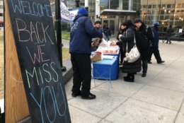 The Southwest Business Improvement District welcomed back furloughed government workers on Monday morning with coffee and doughnuts at L’Enfant Plaza Metro station. (WTOP/Melissa Howell) 