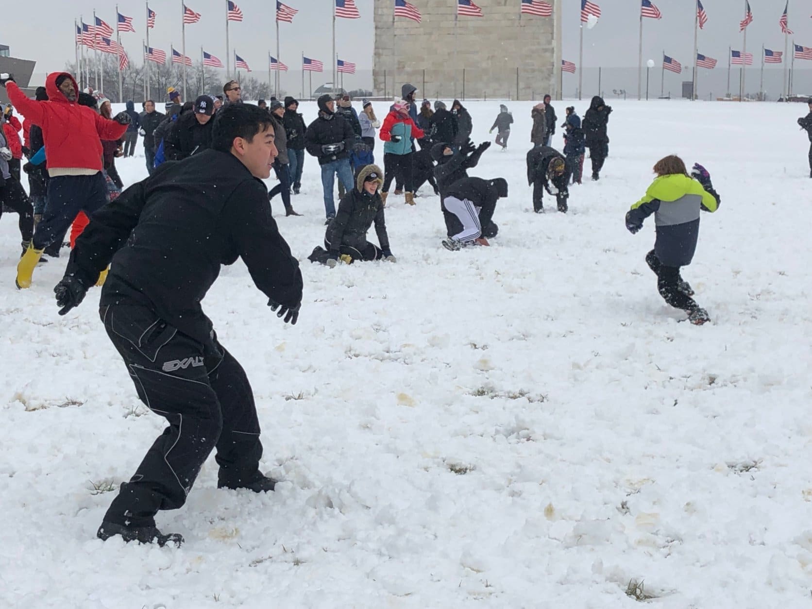 The Washington Monument was the site of a massive snowball fight on Sunday. (WTOP/Keara Dowd)