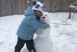 Molly Valm gives her new snowy friend a warm hug. (Courtesy of Steven Valm)