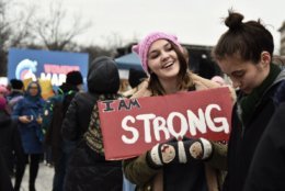 A marcher and her friend try to secure a spot near the main stage in Freedom Plaza, which would quickly become packed with people shoulder-to-shoulder as several thousand turned out for the third iteration of the national Women’s march in D.C. (WTOP/Alejandro Alvarez)