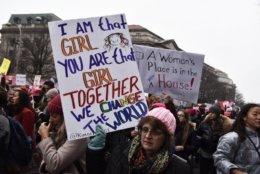 Two signs which exemplify the long-term goal of the original Women’s March — the election of more women to public office. The 2018 midterm elections ushered in a record number of women into the House of Representatives. (The 2019 Women’s March passed directly in front of the Trump International Hotel — a common site for protesters seeking to express their frustration and misgivings with President Trump. The half-mile march featured thousands of people, including some furloughed federal workers, advocating for women’s rights and calling for Trump’s removal from office. (WTOP/Alejandro Alvarez)