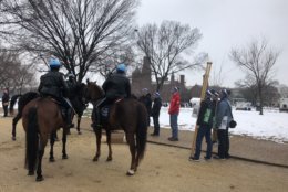 Park Police bundled up on a cold wet Friday for the annual March for Life. (WTOP/Max Smith)