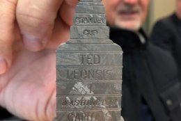 Monumental Sports CEO Ted Leonsis shows off a piece of a meteorite that a fan carved into a replica of the Stanley Cup and gave him as a gift. (WTOP/Julia Ziegler)