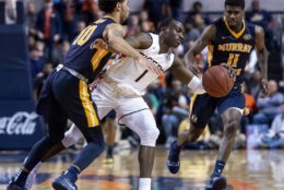 Murray State guard Tevin Brown (10) fouls Auburn guard Jared Harper (1) as Murray State guard Shaq Buchanan (11) trails the play during the second half of an NCAA college basketball game Saturday, Dec. 22, 2018, in Auburn, Ala. (AP Photo/Vasha Hunt)