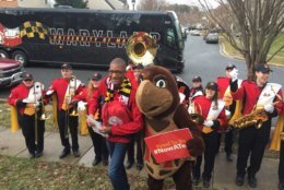 Members of the UMD marching band along with the university's mascot were among those to congratulate Jones on his acceptance to the school. (WTOP/John Domen)