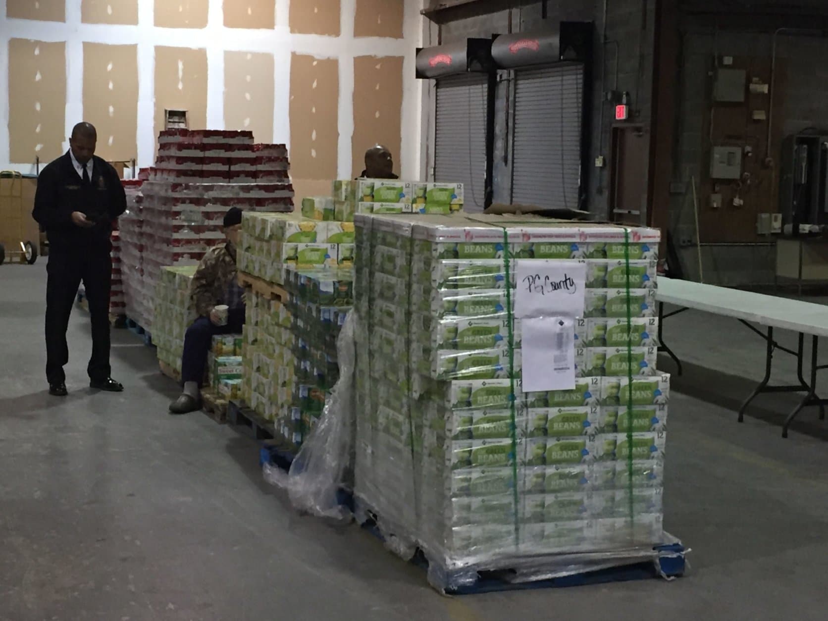 The food donated today, stacked several pallets high, is being distributed to more than a dozen food pantries around Prince George’s County, which will then work with furloughed feds who have reached out for help to make sure they can eat. (WTOP/John Domen)