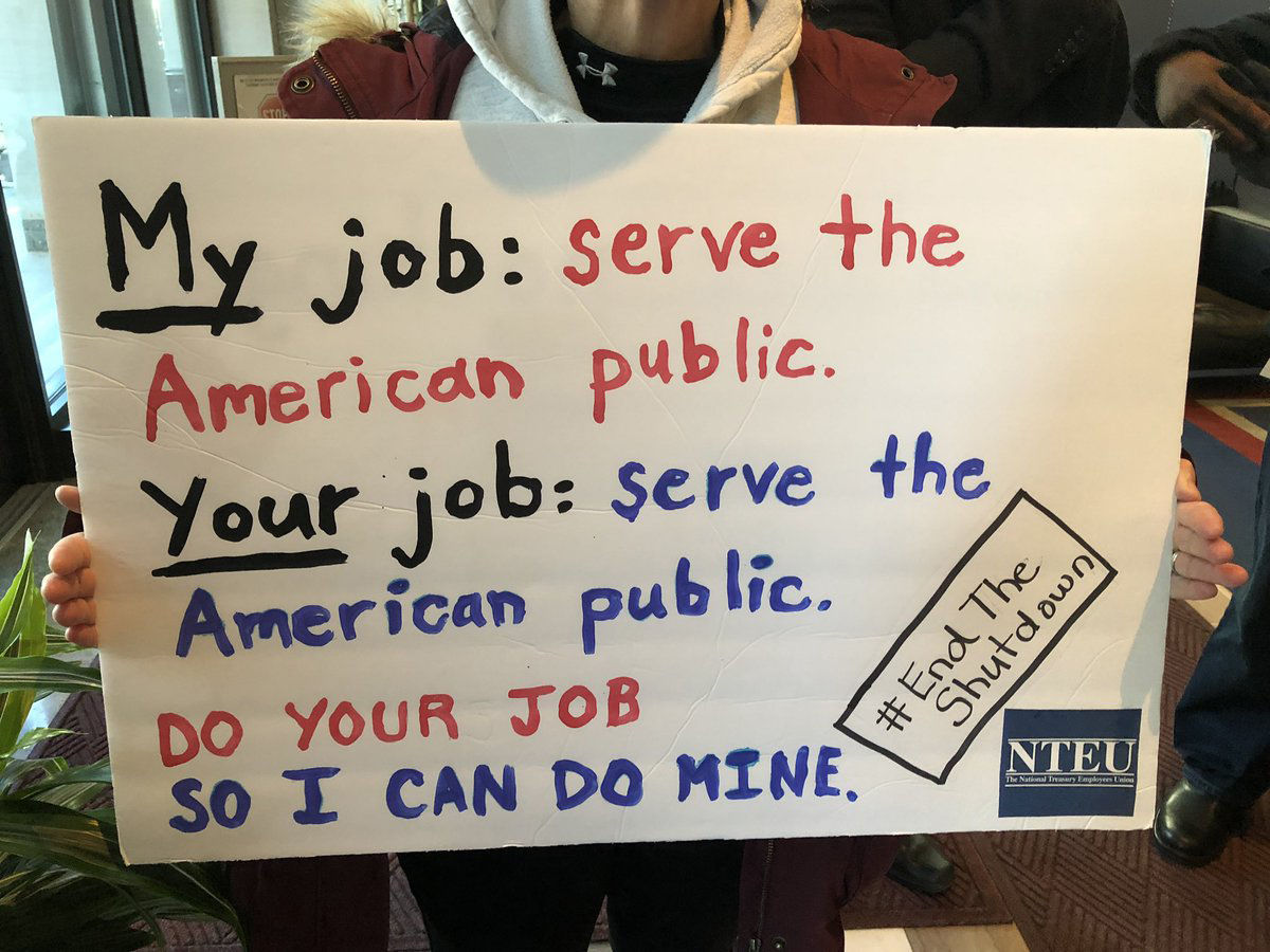 A sign from the rally against the government shutdown Jan. 10, 2019. (WTOP/Kristi King)