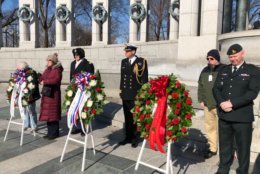 Helping lay the wreaths at the Tuesday ceremony were British and Canadian military dignitaries. From left: Chaplain Lt. Col. Todd Wolf; Cmdr. Richard McHugh; and Maj. Jeff Pederson. (WTOP/Kristi King)
