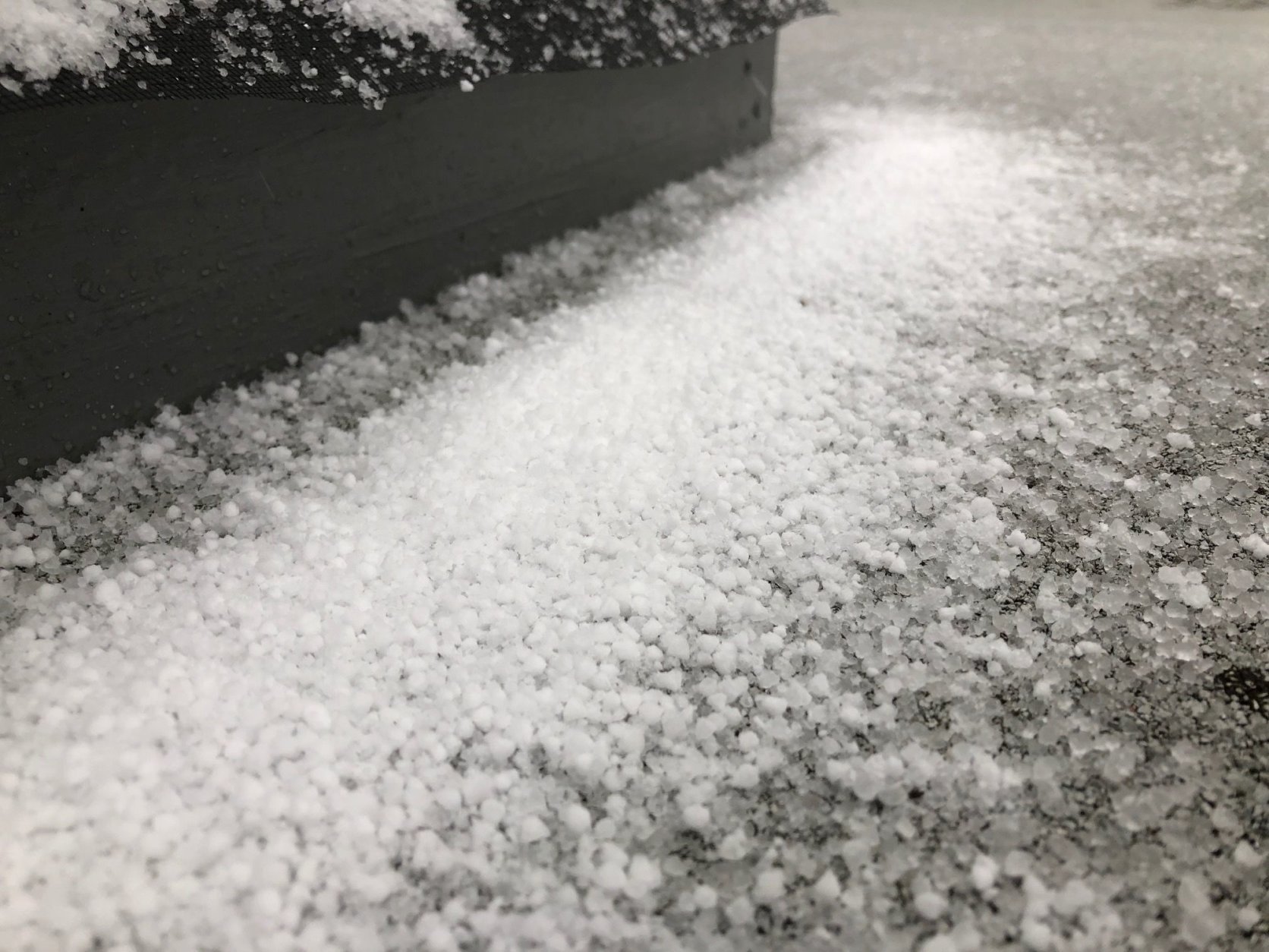 Graupel falls on a roof in Tenleytown, D.C. (WTOP/Dave Dildine)