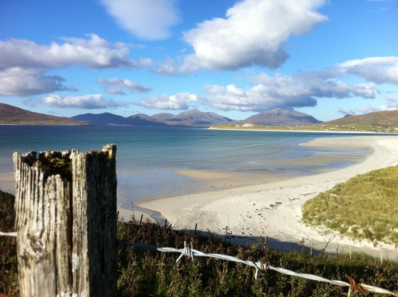 This October 2013 photo shows the startling white-sand beaches on the west coast of the Outer Hebrides in Scotland. The beaches are an easy draw for travelers, though getting into the cold water above your ankles in cooler weather takes some courage _ and a squeal. (AP Photo/Cara Anna)