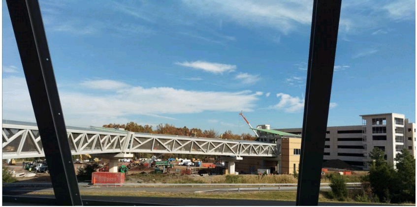 Placing Metal Roofing on Pedestrian Bridge at Loudoun Gateway Station (Courtesy/ Metropolitan Washington Airports Authority)