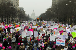 Demonstrators march on Pennsylvania Av. during the Women's March in Washington on Saturday, Jan. 19, 2019.  Organizers had originally planned to gather Saturday on the National Mall, but with the forecast calling for snow and freezing rain Saturday and the National Park Service no longer plowing the snow, the march's location and route was altered this week to start at Freedom Plaza and march down Pennsylvania Avenue past the Trump International Hotel.  (AP Photo/Jose Luis Magana)