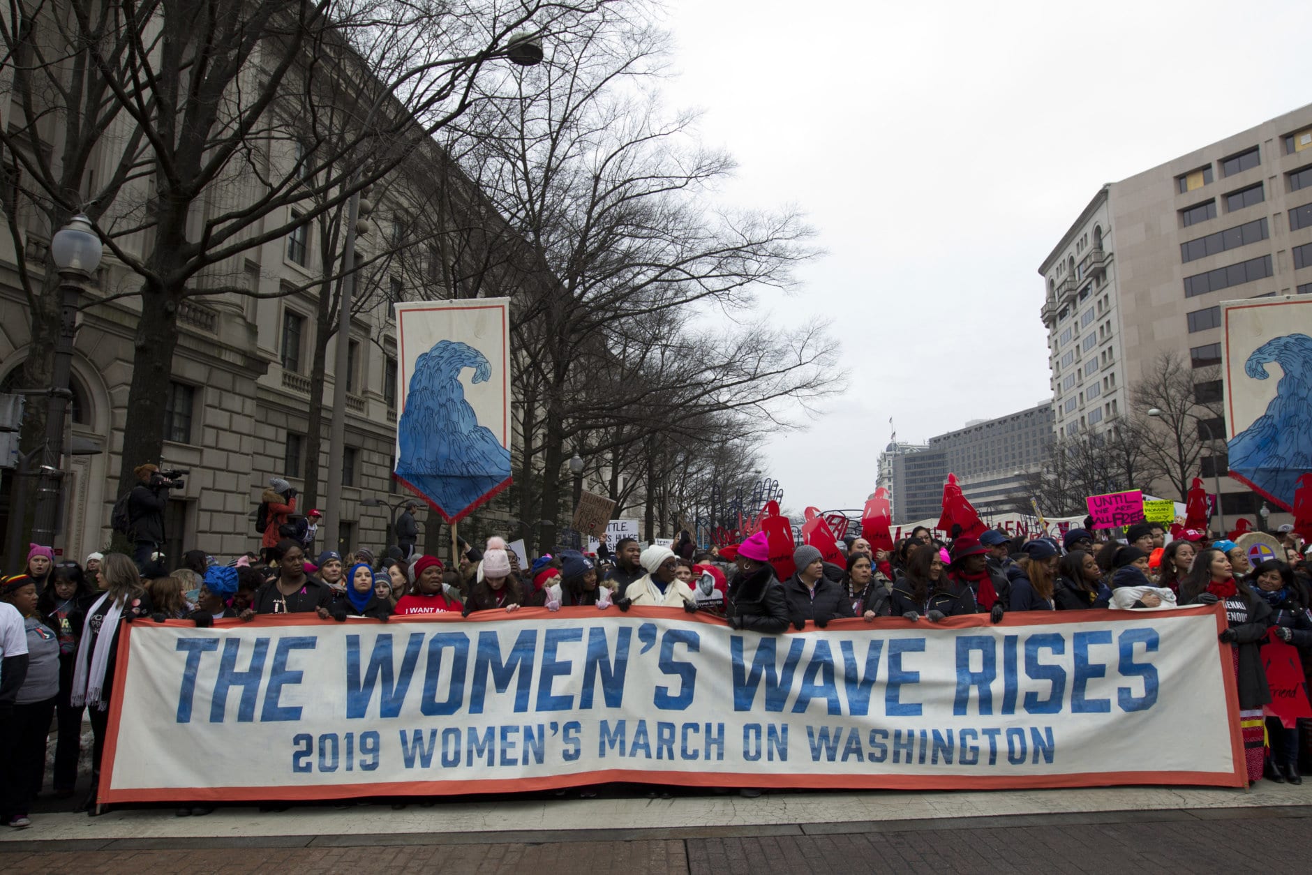 Demonstrators march on Pennsylvania Av. during the women's march in Washington on Saturday, Jan. 19, 2019. (AP Photo/Jose Luis Magana)
