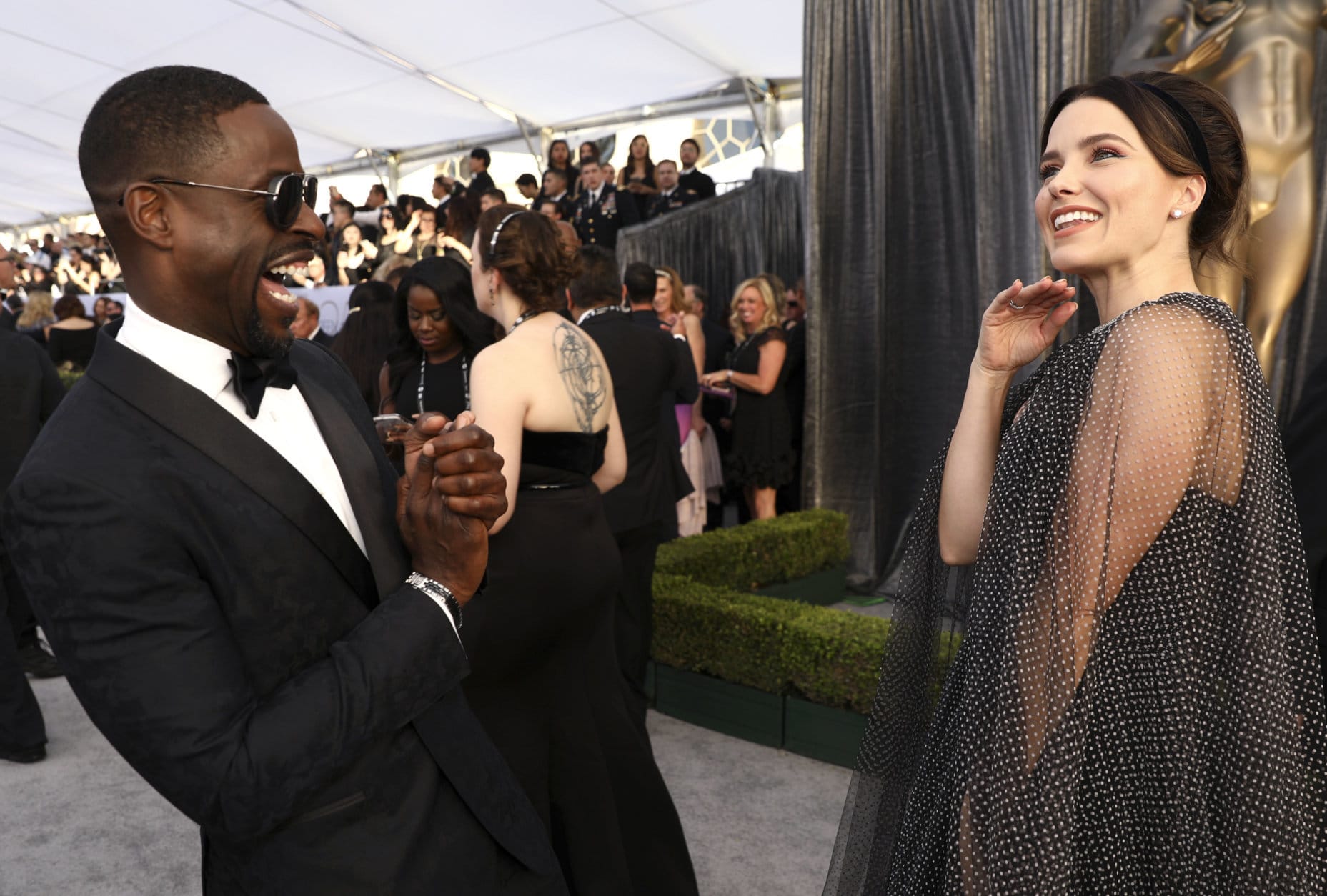 Sterling K. Brown, left, and Sophia Bush appear at the 25th annual Screen Actors Guild Awards at the Shrine Auditorium &amp; Expo Hall on Sunday, Jan. 27, 2019, in Los Angeles. (Photo by Matt Sayles/Invision/AP)
