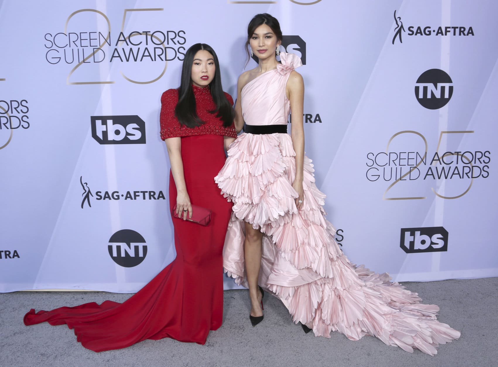 Awkwafina, left, and Gemma Chan arrive at the 25th annual Screen Actors Guild Awards at the Shrine Auditorium &amp; Expo Hall on Sunday, Jan. 27, 2019, in Los Angeles. (Photo by Willy Sanjuan/Invision/AP)
