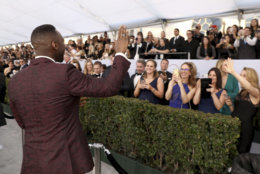 Mahershala Ali waves to fans at the 25th annual Screen Actors Guild Awards at the Shrine Auditorium &amp; Expo Hall on Sunday, Jan. 27, 2019, in Los Angeles. (Photo by Matt Sayles/Invision/AP)