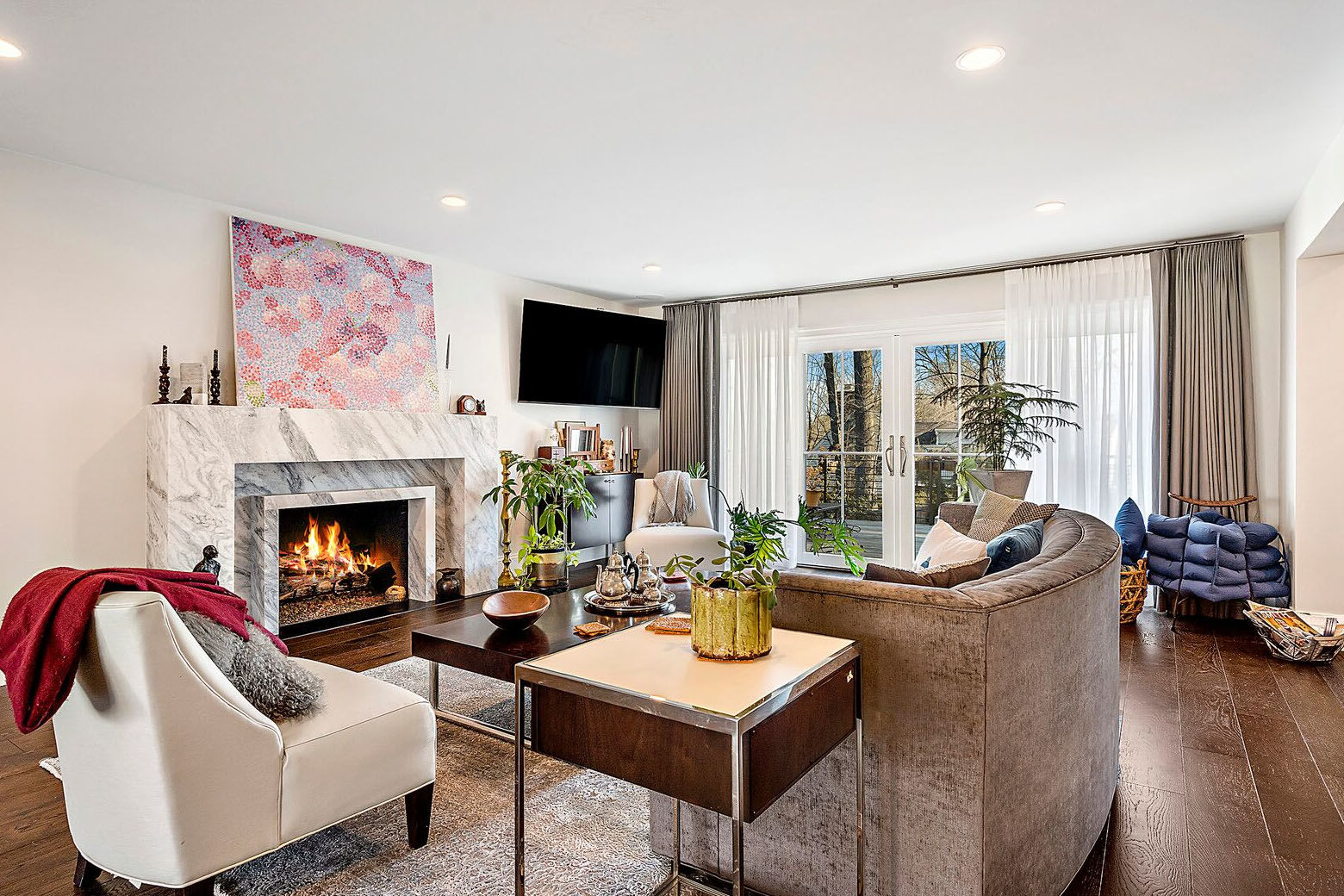 The 5,512-square-foot house features walnut hardwood floors throughout the house. Other luxury features include a custom-designed gas fireplace with Carrera marble. (Courtesy Century 21 New Millennium/RealMarkets)