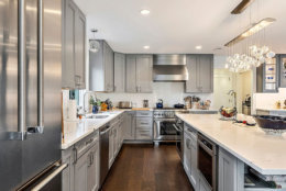 The gourmet kitchen features stainless steel Thermador appliances. (Courtesy Century 21 New Millennium/RealMarkets)