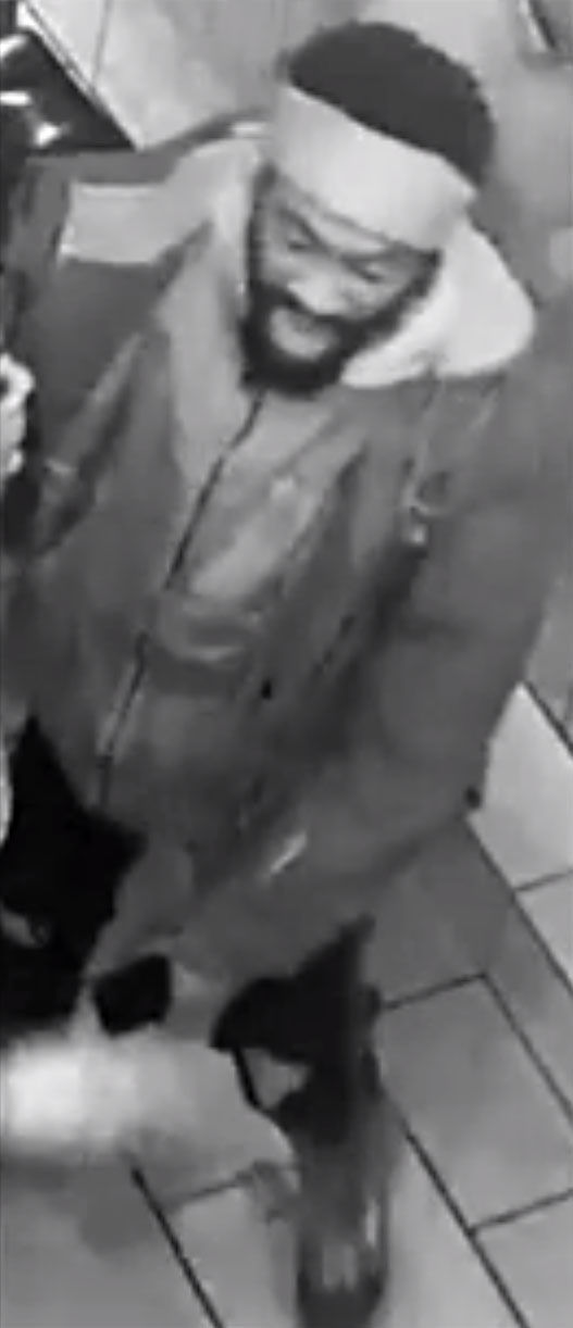 The second suspect. The surveillance video shows him slamming a bar stool over the victim who was shot. (Courtesy D.C. police)
