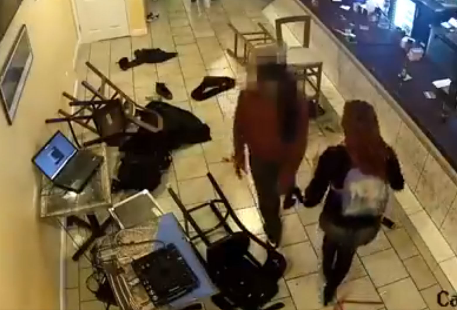 A screencap of a surveillance video showing the aftermath of a shooting inside an H Street restaurant. (Courtesy D.C. police) 