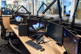 WTOP's new office space, shared with sister station Federal News Radio, is just under 31,000 square feet in an eight-story building just a short walk from the Friendship Heights Metro station in Maryland. The extra space allows for a whole array of new technology, including recording equipment at every station and larger screens for the digital team (pictured). Most work stations also have the ability to convert into standing desks with the push of a button. (WTOP/Alejandro Alvarez)