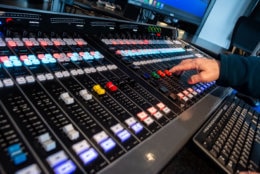 A close-up view of the main control board in WTOP's new Glass-Enclosed Nerve Center. With this audio mixer, an anchor can feed live audio from any of the 47 editing stations throughout the new office, or pre-recorded news reports from WTOP's affiliates. (WTOP/Alejandro Alvarez)