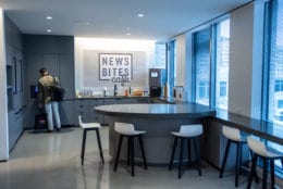 The new office cafe, News Bites, features free coffee, tea and carbonated water dispensers, as well as plenty of seating space with a view of Friendship Heights. Its name was chosen by vote, beating runner-up "#Food4Thought." (WTOP/Alejandro Alvarez)