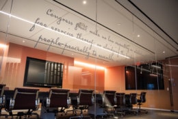 Like the Idaho Avenue building, the First Amendment will feature prominently in the new office. Pictured, the 45 words which ensrine five freedoms are stenciled on glass panels facing the reception area. (WTOP/Alejandro Alvarez)