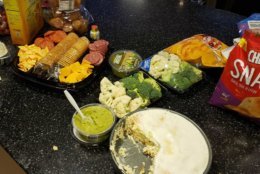 Broccoli and cauliflower go untouched next to the cheesecake. (WTOP/Brandon Millman) 