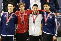 Justin Haddad on the podium with the top eight in Cadet Men's Epee.  Feb. 18, 2019 at the USA Fencing Junior Olympic Championships in Denver, Colorado. (Courtesy D.C. Fencer's Club)