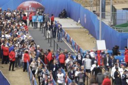 Fans stand in line at the Mercedes-Benz Stadium before the NFL Super Bowl 53 football game between the Los Angeles Rams and the New England Patriots, Sunday, Feb. 3, 2019, in Atlanta. (AP Photo/Charlie Riedel)