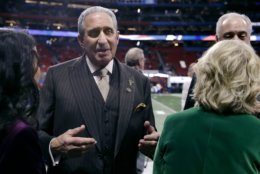 Atlanta Falcons owner Arthur Blank speaks to people on the sideline before the NFL Super Bowl 53 football game between the Los Angeles Rams and the New England Patriots Sunday, Feb. 3, 2019, in Atlanta (AP Photo/Carolyn Kaster)